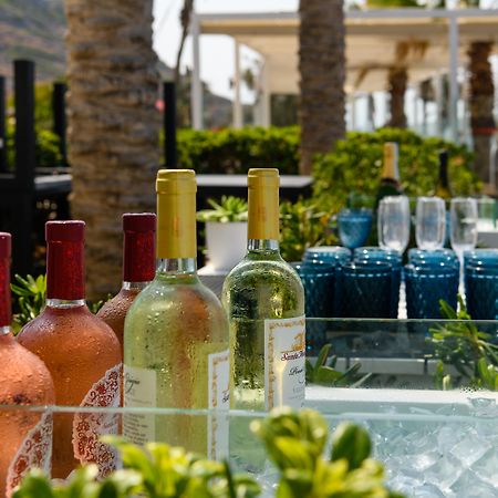 Minos Imperial Luxury Beach Resort & Spa Milatos Dış mekan fotoğraf Wine at a poolside bar
