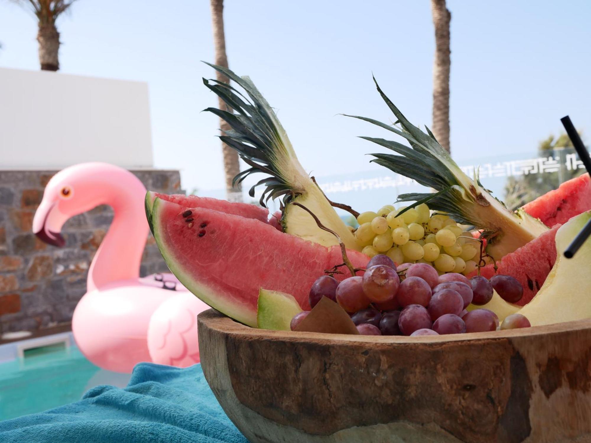 Minos Imperial Luxury Beach Resort & Spa Milatos Dış mekan fotoğraf A pink flamingo float